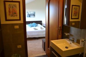 Letto o letti in una camera di B&B Due Fontane
