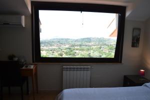 Letto o letti in una camera di B&B Due Fontane