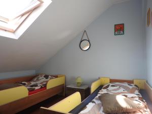 Postel nebo postele na pokoji v ubytování Kwatery u Rysia