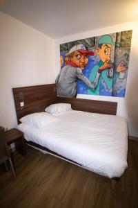 Postel nebo postele na pokoji v ubytování Hôtel le Pastel