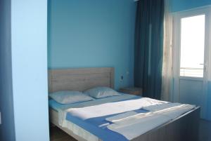 Letto o letti in una camera di David Guest House