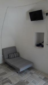 Televízia a/alebo spoločenská miestnosť v ubytovaní Concita's Trulli