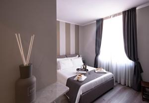 a hotel room with a bed and a window at Il Genovino in Genoa