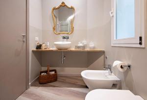 a bathroom with a sink and a mirror at Il Genovino in Genoa