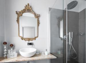 a bathroom with a sink and a mirror at Il Genovino in Genoa
