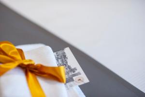 a book with a yellow bow on top at Il Genovino in Genoa