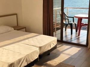 Letto o letti in una camera di M-Rooms