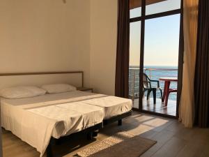 Letto o letti in una camera di M-Rooms