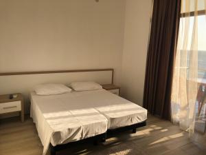 Letto o letti in una camera di M-Rooms