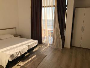 Letto o letti in una camera di M-Rooms