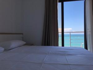 Letto o letti in una camera di M-Rooms