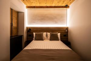 Postel nebo postele na pokoji v ubytování Casa Pasini-Foresteria