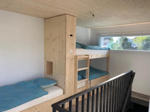 Postel nebo postele na pokoji v ubytování mytinyhome