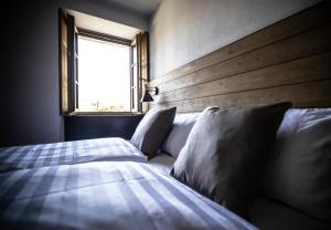 Postel nebo postele na pokoji v ubytování Casa Pasini-Foresteria