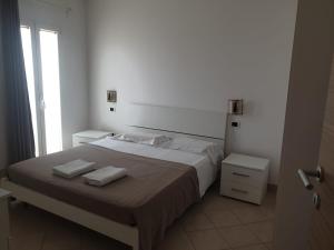 Postel nebo postele na pokoji v ubytování Aparthotel Por do Sol