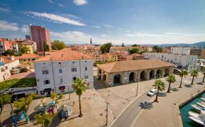a view of a city with buildings and a street at Casa Orange in Koper
