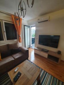 TV o dispositivi per l'intrattenimento presso Apartman Lux Doboj