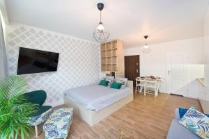 Telewizja i/lub zestaw kina domowego w obiekcie YOURAPART Chmielna Park