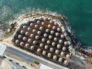 an aerial view of a building next to the ocean at Hotel Salsello in Bisceglie