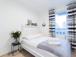 Posteľ alebo postele v izbe v ubytovaní Apartamenty Sunrise Kolobrzeg Podczele