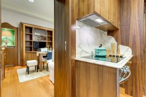 a kitchen with a sink and a counter top at Pantheon Antique Suite in Rome