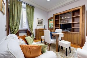 a living room with a couch and a table at Pantheon Antique Suite in Rome