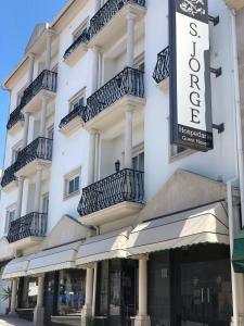 a large white building with balconies on it at Hospedaria S. Jorge in Fátima +14 photos