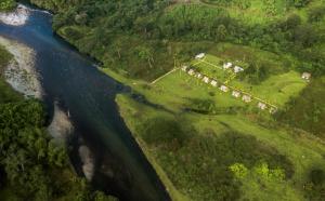 an aerial view of a river and a house at Namosi Eco Retreat in Navunikambi