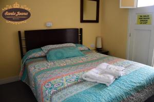 Cama o camas de una habitación en Hotel Santa Juana