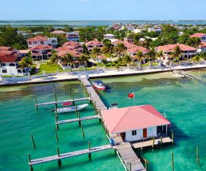 an aerial view of a resort with a dock and a boat at Isla Bonita Yacht Club in San Pedro