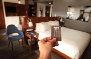 Voodi või voodid majutusasutuse Hotel Hugo toas