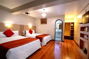 Cama ou camas em um quarto em Royal Inka II