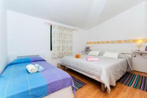 Voodi või voodid majutusasutuse Apartment Dijana toas