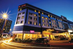 a building on a city street at night at RHR Hotel Kajang in Kajang