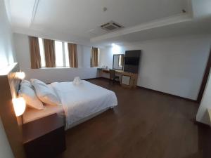 Katil atau katil-katil dalam bilik di Sara Hotel