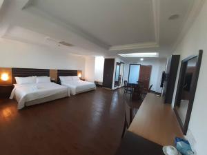 Katil atau katil-katil dalam bilik di Sara Hotel
