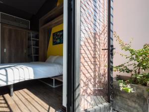 Postel nebo postele na pokoji v ubytování Wings House