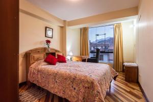 Giường trong phòng chung tại Espacioso confortable apartamento familia