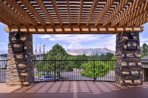a large stone wall with a bridge over it at Best Western Plus Peak Vista Inn & Suites in Colorado Springs