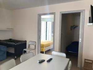 Ένα ή περισσότερα κρεβάτια σε δωμάτιο στο Lido Marini