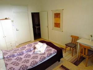 Ένα ή περισσότερα κρεβάτια σε δωμάτιο στο Majatalo Myötätuuli