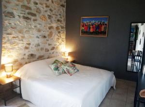 Postel nebo postele na pokoji v ubytování Domaine des Goudis