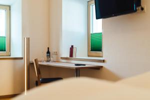 Telewizja i/lub zestaw kina domowego w obiekcie Nowders Apartments