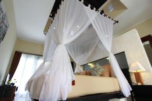 Ein Bett oder Betten in einem Zimmer der Unterkunft Nike Villas