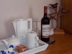 a bottle of wine sitting on top of a table at Chiverton House Guest Accommodation in Penzance