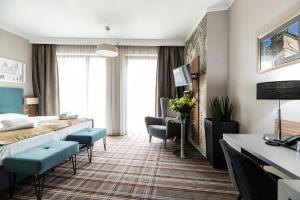 Televízia a/alebo spoločenská miestnosť v ubytovaní Hotel Perfect