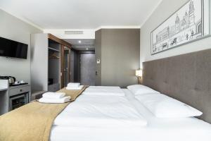 Posteľ alebo postele v izbe v ubytovaní Hotel Perfect