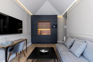 TV a/nebo společenská místnost v ubytování Apartamentos Pedregalejo