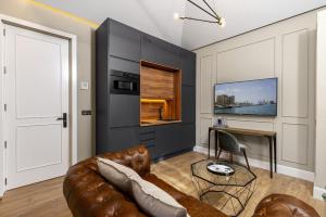 TV a/nebo společenská místnost v ubytování Apartamentos Pedregalejo