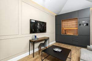 TV a/nebo společenská místnost v ubytování Apartamentos Pedregalejo
